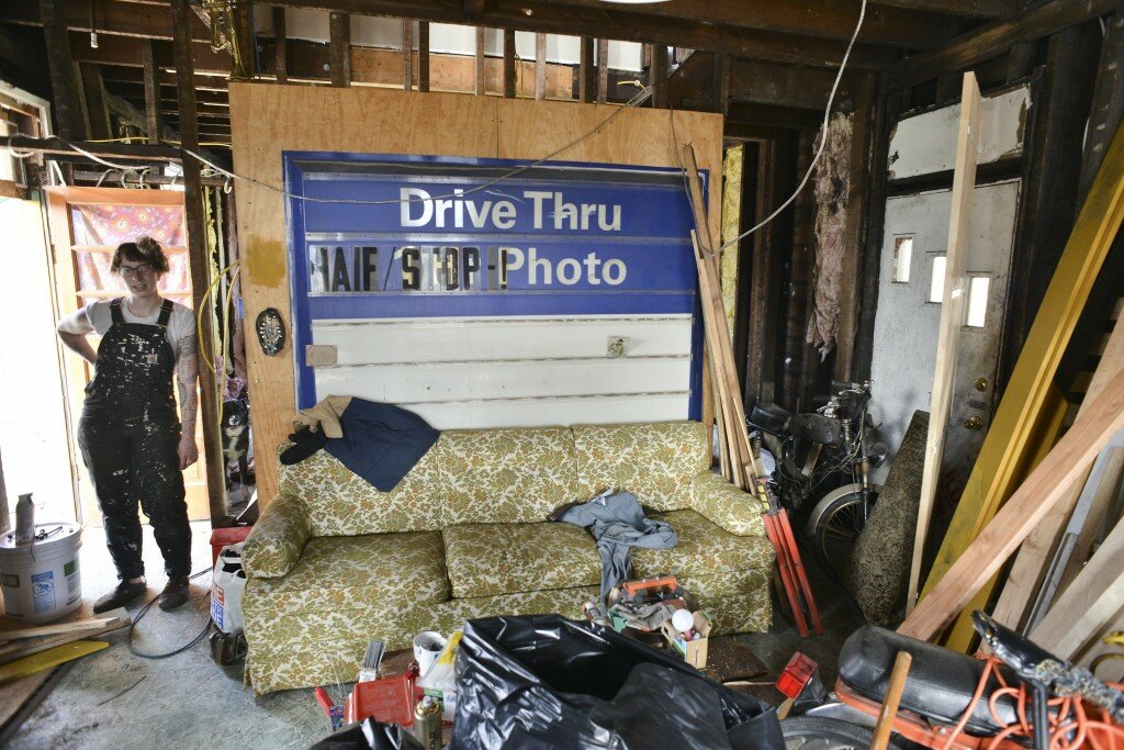 Sarah LaPonte, 26, in the livingroom of her $700 home in Braddock. John Rennison, Hamilton Spectator 