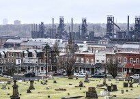 The blast furnaces of Bethlehem Steel can still be seen above the homes where steel workers once lived. Now the furnaces are part of Steel Stacks, a tourist attraction. John Rennison, Hamilton Spectator