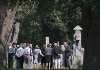 Hamilton, Ontario, July 27,2015 Family Internment of Rosa Parry's ashes at Hamilton Cemetery. Parry left her body to science when she died in her 90's. In this photo John Parry Rosa's nephew , far right, leads the family in a prayer. Cathie Coward / Hamilton Spectator