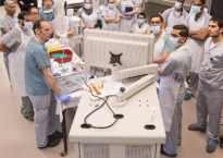 Neurovascular surgical residents gather in McMaster’s anatomy lab to practice treating pituitary tumours in the brain. A camera is inserted through the cadaver’s nasal cavity, and images shown on a monitor. Photo by Cathie Coward/Hamilton Spectator